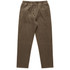 Cord pants in a warm brown colour, featuring an elastic waistband and drawstring. Suitable for casual wear.