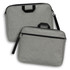 A grey satchel with a handle and adjustable strap, featuring zippers and a front pocket.