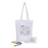 A foldable calico tote bag in white, featuring a colouring design, alongside a pencil case, markers, and a notebook.