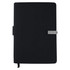 A black notebook with a smooth cover, a clip closure, and a pen loop, featuring a logo on the front.