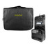 A black toiletry bag with a hanging design, featuring clear pockets and a hook for easy storage.
