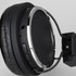 A pair of black Bluetooth headphones with silver accents and control buttons on one side.