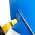A blue metal ice cooler box with a drink bottle partially inserted into a bottle opener attachment.
