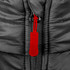 A close-up of a black puffer vest featuring a zip with a red pull tab and a branded logo.