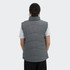 A women's puffer vest in grey, featuring a high collar and a quilted design, with a branding logo on the back.