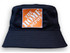 A navy blue bucket hat with a square logo in orange and white, featuring a wide brim and textured fabric.
