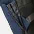 A navy soft-touch backpack with a zippered compartment and textured lining, featuring mesh detailing and adjustable straps.