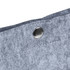 A close-up of a grey felt tote bag featuring a metal snap button and stitched detailing.