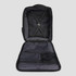 An open black travel backpack featuring multiple compartments and a patterned interior. It has a logo on the exterior.