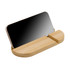 A bamboo phone stand featuring a sleek, curved design, holding a smartphone upright.