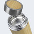 A drink bottle made of bamboo with a stainless steel lid and a mesh filtration insert visible inside.