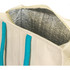 A cooler bag with a cream exterior, turquoise handles, and a silver insulated interior.