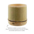 A bamboo candle holder featuring natural cracking and a light green hue. The holder has a rustic, organic appearance.
