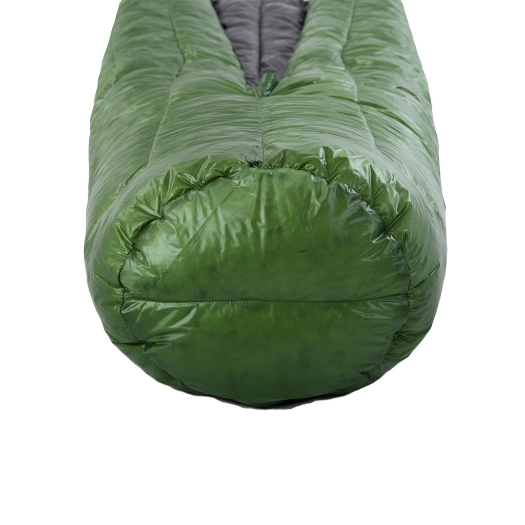 bottom view of a sewn-closed footbox from a  forest green shell lightweight down sleeping bag quilt with a charcoal gray interior