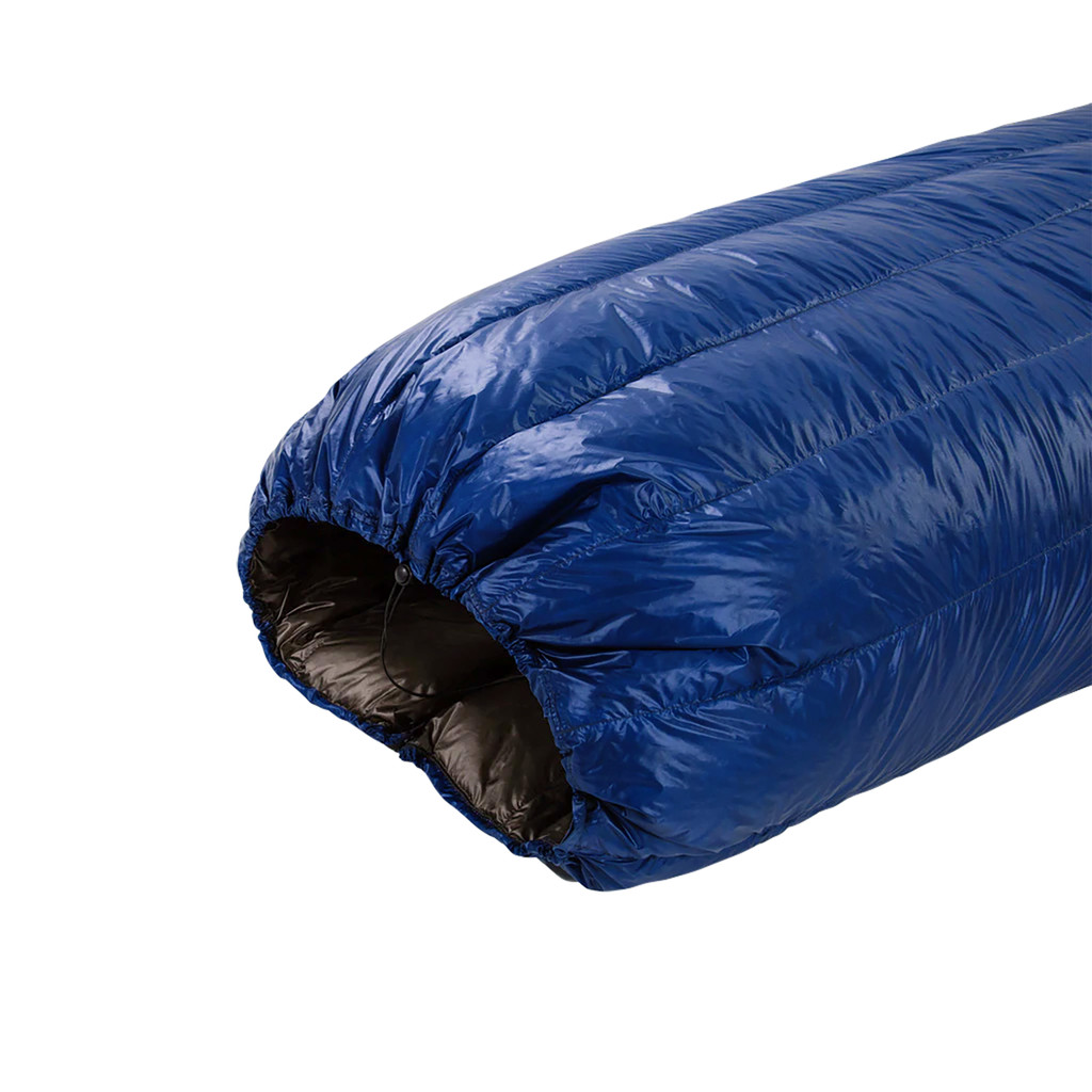 close up top view of a navy blue shell lightweight down sleeping bag quilt with a charcoal gray interior 