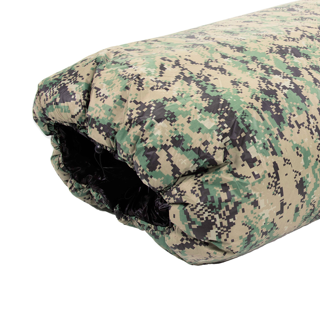 close up top view of a digicam camouflage shell lightweight synthetic sleeping bag quilt with a black interior