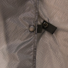 close up view of the snaps that allow for full range of movement and ventilation from an adjustable unisex charcoal grey lightweight, durable, functional rain coverage accessory