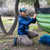 in use photo of a person utilizing their lightweight insulated pullover to stay warm while they set up their under quilt 