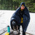 in use shot of a person using the aegean shell lightweight down sleeping bag quilt with a black interior to keep them warm in cold temperatures 