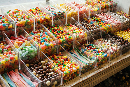 Colorful candy bins filled with assorted sweets food photography