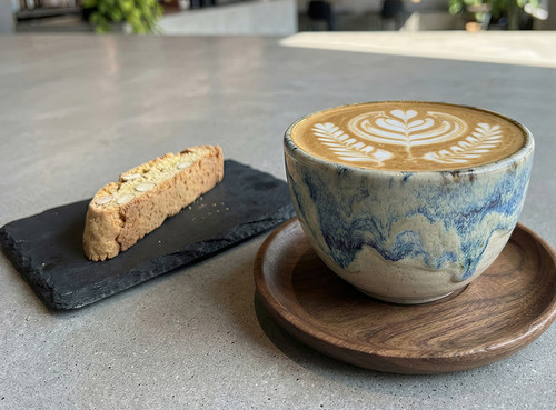 Cappuccino with biscotti on a plate