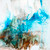 Dreamlike abstract mixed media artwork on metal with soft flowing forms and atmospheric layered color
