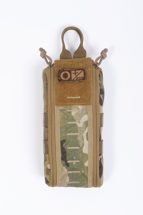 1000D Nylon construction with YKK zippers.  Vecro swatch below thumb loop can be used for individual name tag, blood type tag, allergy tag, etc.  MOLLE compatible.
