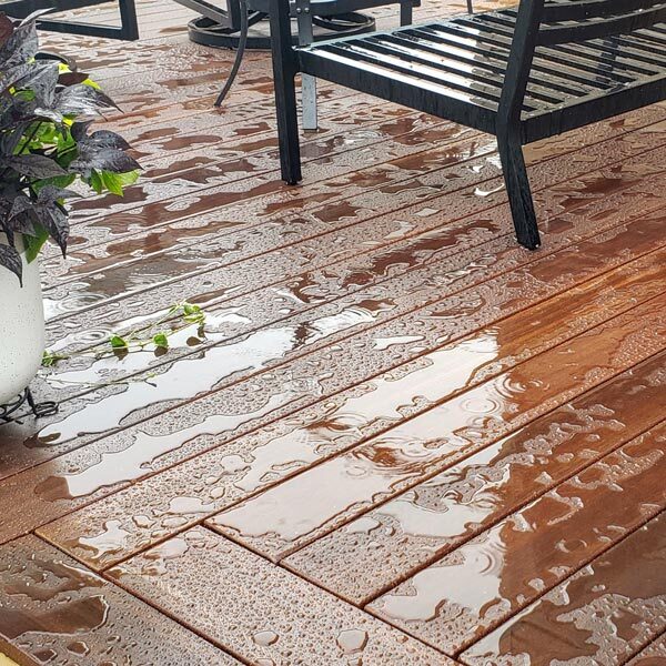 Water beads on freshly oiled wooden deck