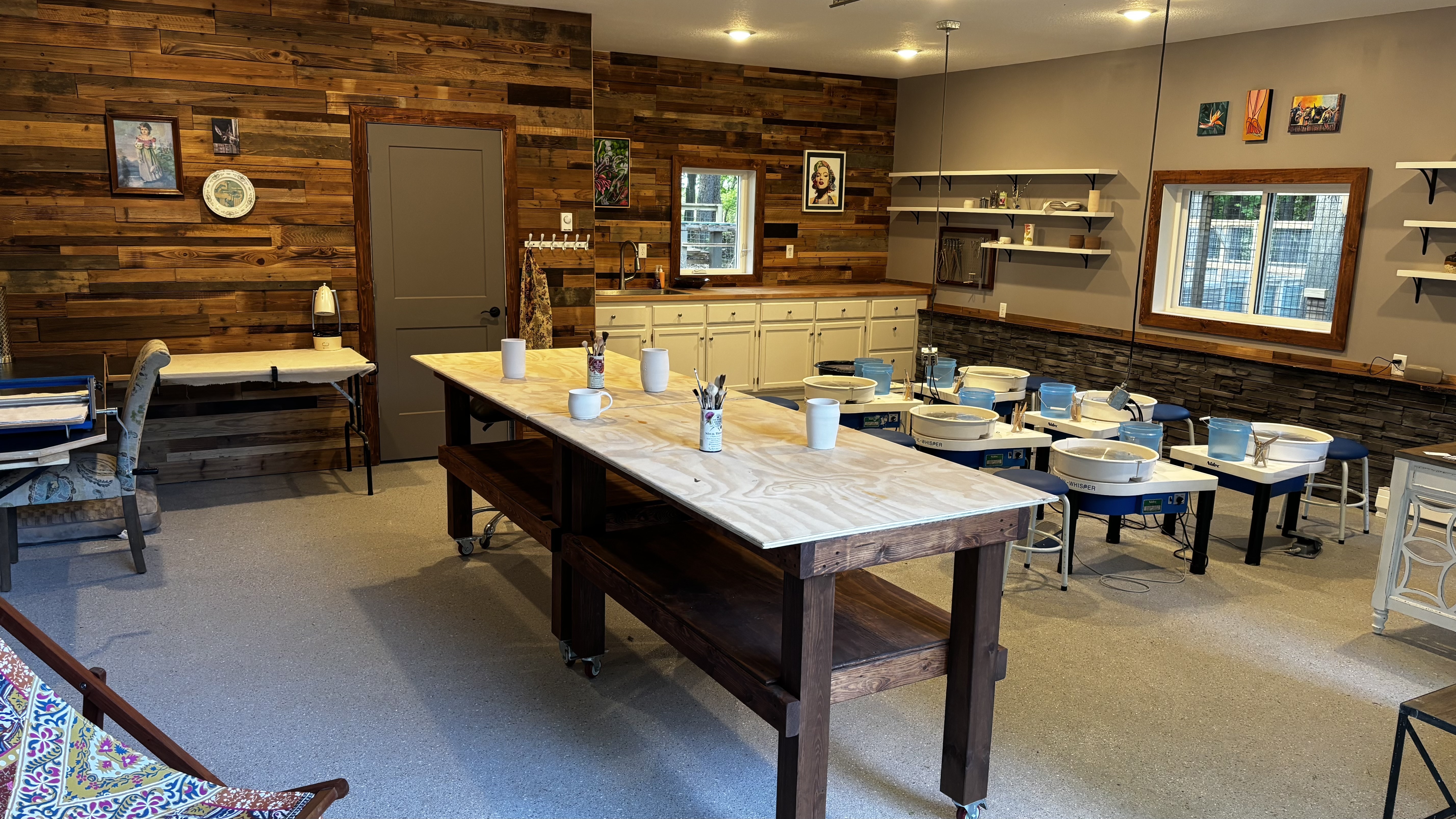 Pottery studio with large table and individual stations