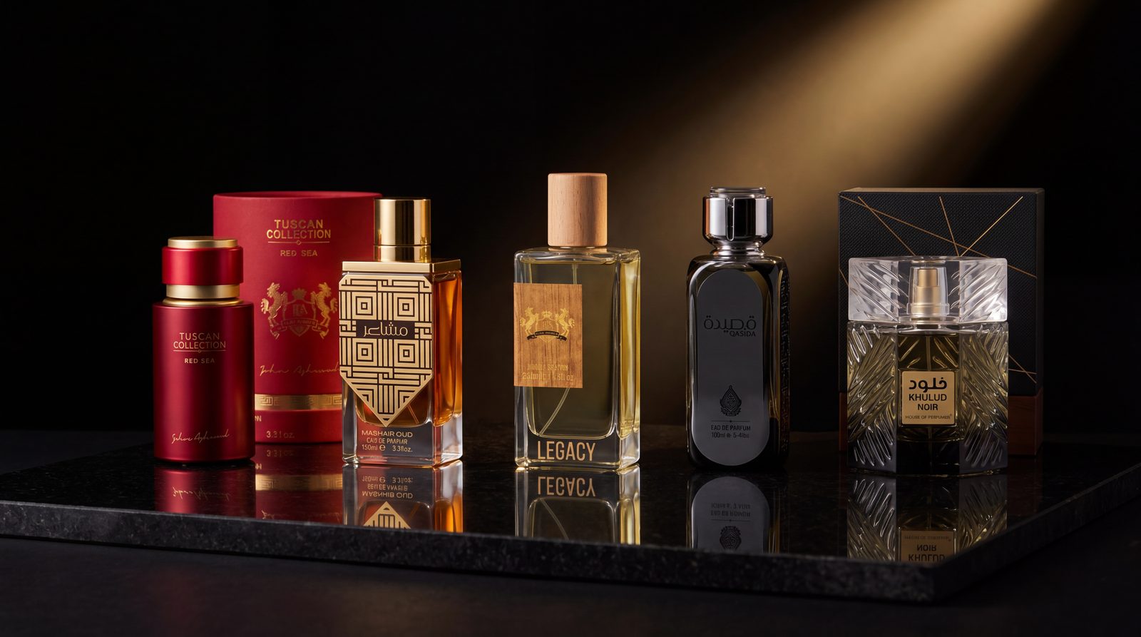 A row of fragrances lit by a warm golden shaft on dark polished stone