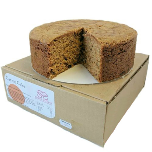 10 inch carrot sponge cake on top of a box