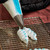 Piping bag with Colour Mill Piping Tip 125 Petal on end