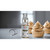 Sugarflair Powder Puff Glitter Non-Aerosol Spray Flash Gold next to cupcakes