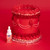 bottle of red colour drops with red cake