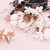Gold & White dried mixed flowers displayed on a pink background