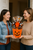 Happy Halloween Haul pumpkin gift basket being given as a Halloween gift between friends