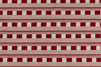 Lost and Found fabric in ruby red, featuring a woven check pattern with contrasting coloured stripes. This rich and warm tone brings a dynamic, bold touch to any space, ideal for statement upholstery and custom soft furnishings.
