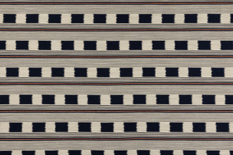 Lost and Found fabric in rich indigo, featuring a woven check pattern with contrasting orange stripes. This deep, sophisticated hue adds a sense of luxury and refinement, ideal for upholstery, feature headboards, and custom soft furnishings.