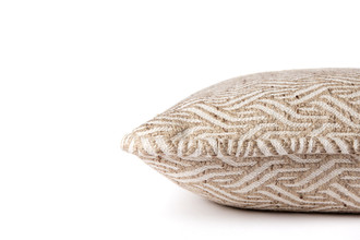 Side View of Woven ‘Tangle’ cushion in natural tones with a luxurious textured finish and self-piped edge. Belgian-made and fabric designed by And Objects. Each cushion is unique.