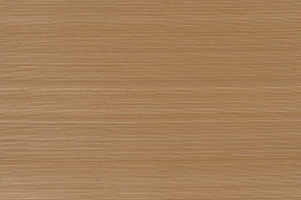 Natural abaca grass cloth wallpaper in warm golden-brown tones with fine horizontal texture.