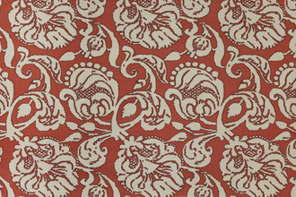 Anna floral linen fabric in red tones with a repetitive floral pattern, designed by Michael Szell for Christopher Farr Cloth.