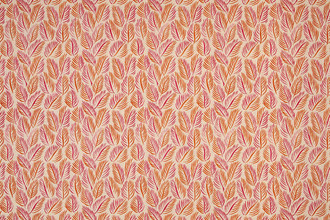 Armatures Feuilles luxury printed linen fabric featuring a vibrant hot pink and orange leaf design, showcasing the fine texture and bold, colourful pattern.