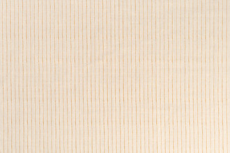 Broken Stripe printed linen fabric in honey on a white linen background, with a subtle hand-drawn inspired stripe design.