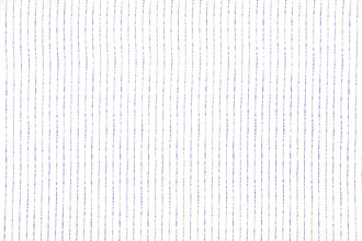 Broken Stripe printed linen fabric in indigo on a white linen background, featuring a striking, hand-drawn look with a delicate stripe design.