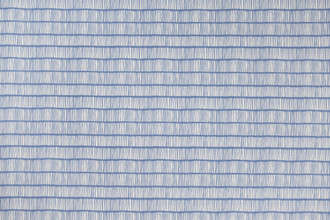 Crochet Performance Printed Fabric in Blue, featuring a rich blue and white two-tone abstract linear pattern, perfect for both indoor and outdoor spaces.