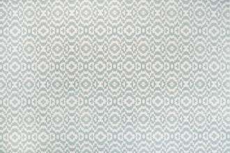 Echo Printed Fabric in Pale Blue, featuring delicate blue ikat-inspired circles on natural linen, offering a calm, airy feel for soft furnishings.