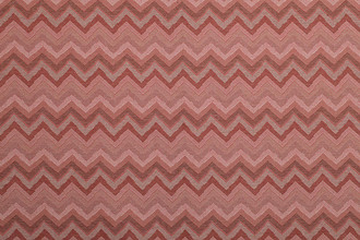 Kazulu Performance Fabric in Rosso—bold zigzag design in tonal reds and soft neutrals, perfect for adding warmth and visual texture to upholstery.
