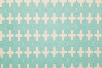 Laguna Printed Fabric in Turquoise – bold Aztec-inspired geometric pattern printed in vibrant turquoise on natural white linen.