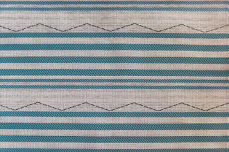 MARE Performance Woven Fabric in Turchese, featuring a bold zigzag stripe in turquoise and neutral tones, ideal for adding vibrancy and texture to interior and exterior high-traffic spaces.