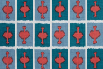Ozone Printed Fabric in Coral — a warm, vibrant ikat geometric pattern with offbeat grid-like lines in a soft coral tone, perfect for adding a relaxed yet dynamic feel to modern furnishings.
